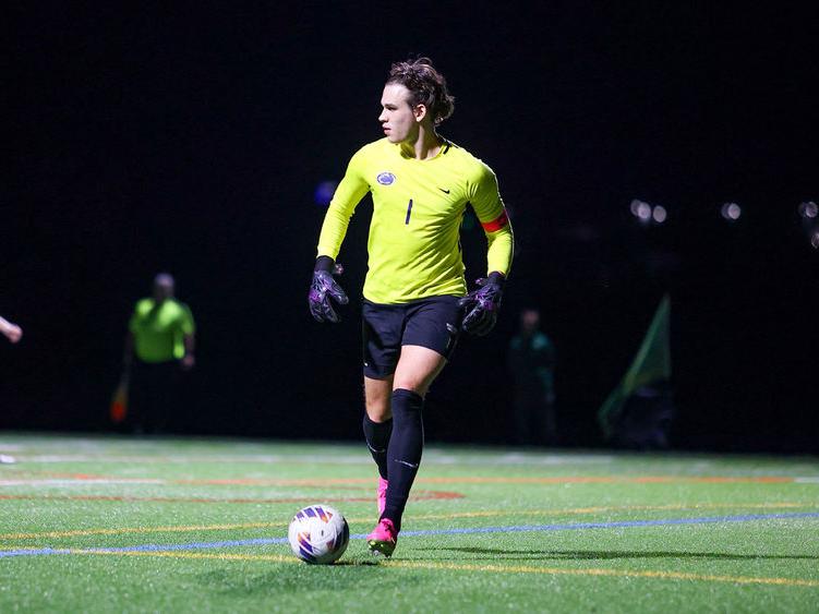 Sasha Mohoruk playing goalie in the middle of a soccer game